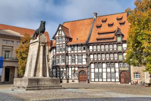 Statue of Lion and half-timbered building in Braunschweig